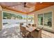 A gorgeous patio with a wooden ceiling, fan, and view of the pool; perfect for enjoying the outdoors at 911 S Sterling Ave, Tampa, FL 33629
