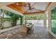Inviting outdoor patio with brick pavers, a covered ceiling, and a ceiling fan; perfect for dining and entertaining at 911 S Sterling Ave, Tampa, FL 33629