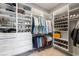 Spacious walk-in closet with custom shelving, drawers, and ample storage space for clothes and accessories at 911 S Sterling Ave, Tampa, FL 33629