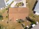 Birds eye view of a home with a well maintained lawn, garden, mature landscaping and a driveway with parking at 106 Silverbell Ct, Sun City Center, FL 33573