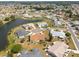 Overhead view of homes and lakefront properties in a serene neighborhood at 106 Silverbell Ct, Sun City Center, FL 33573