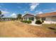 A well-kept backyard with mature landscaping complements this charming home at 106 Silverbell Ct, Sun City Center, FL 33573