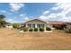 A well-kept backyard with mature landscaping complements this charming home at 106 Silverbell Ct, Sun City Center, FL 33573
