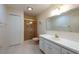 Bright bathroom featuring tile flooring, white vanity, and glass-enclosed shower at 106 Silverbell Ct, Sun City Center, FL 33573