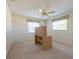 Bedroom with natural light, neutral carpet, and a ceiling fan at 106 Silverbell Ct, Sun City Center, FL 33573