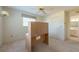 Bedroom with a ceiling fan, closet, and access to the bathroom at 106 Silverbell Ct, Sun City Center, FL 33573