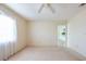 Bedroom with a ceiling fan and view to the kitchen at 106 Silverbell Ct, Sun City Center, FL 33573