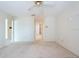 Spacious bedroom with a ceiling fan and carpet at 106 Silverbell Ct, Sun City Center, FL 33573