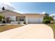 Charming home with a well-maintained lawn and inviting curb appeal at 106 Silverbell Ct, Sun City Center, FL 33573