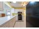 Bright eat-in kitchen features updated appliances, white cabinetry, and tile flooring at 106 Silverbell Ct, Sun City Center, FL 33573
