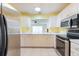 Bright kitchen offering lots of cabinets and counter space at 106 Silverbell Ct, Sun City Center, FL 33573