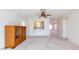 Living room featuring view into the kitchen and open layout perfect for entertaining at 106 Silverbell Ct, Sun City Center, FL 33573