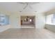 Bright sunroom with tile flooring and ceiling fan at 106 Silverbell Ct, Sun City Center, FL 33573