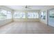 Spacious sunroom with tile flooring and lots of windows at 106 Silverbell Ct, Sun City Center, FL 33573
