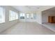 Bright sunroom with tile flooring and multiple windows at 106 Silverbell Ct, Sun City Center, FL 33573