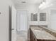 Bathroom featuring granite countertop with a white sink and tile flooring at 1119 Ballard Green Pl, Brandon, FL 33511