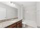 Bathroom featuring granite countertop with a white sink and a shower-tub combination at 1119 Ballard Green Pl, Brandon, FL 33511