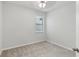Bright, neutral bedroom with a window and plush carpeting at 1119 Ballard Green Pl, Brandon, FL 33511