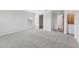 Bright bedroom with carpet flooring leading to the walk-in closet and luxurious bathroom at 1119 Ballard Green Pl, Brandon, FL 33511