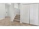 Inviting entryway with tile flooring, a staircase, and a coat closet providing ample storage space at 1119 Ballard Green Pl, Brandon, FL 33511