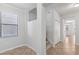 Upstairs hallway featuring neutral walls, tile flooring, and a staircase at 1119 Ballard Green Pl, Brandon, FL 33511