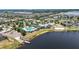 Expansive aerial view of the community clubhouse, pool, and lakefront amenities, showing a desirable waterfront lifestyle at 11322 Lake Lucaya Dr, Riverview, FL 33579