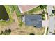 Birds eye view of house with a large backyard featuring a patio and partial pond view, with a glimpse of a screened pool at 11322 Lake Lucaya Dr, Riverview, FL 33579