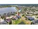 Panoramic aerial view capturing a serene lake community, highlighting a home with a backyard, in a peaceful neighborhood at 11322 Lake Lucaya Dr, Riverview, FL 33579