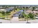 Charming home with a two-car garage, well-maintained landscaping, and a welcoming entrance, on a tree-lined street at 11322 Lake Lucaya Dr, Riverview, FL 33579