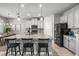 Stylish kitchen features a large island with granite countertops and modern appliances at 11322 Lake Lucaya Dr, Riverview, FL 33579