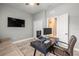 Functional home office with modern desk setup, comfortable seating, and a large screen for productivity at 11322 Lake Lucaya Dr, Riverview, FL 33579