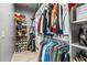 Organized walk-in closet with hanging clothes and shelves for shoes and accessories at 11322 Lake Lucaya Dr, Riverview, FL 33579