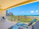 Balcony with outdoor chairs overlooking beautiful beach and ocean views at 1200 Gulf Blvd # 404, Clearwater Beach, FL 33767