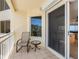 Cozy balcony with seating and views, perfect for relaxing outdoors at 1200 Gulf Blvd # 404, Clearwater Beach, FL 33767