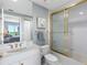 Bright bathroom featuring a bathtub with shower and elegant vanity with sink at 1200 Gulf Blvd # 404, Clearwater Beach, FL 33767
