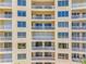 Condo exterior showcasing multiple floors, private balconies, and abundant natural light at 1200 Gulf Blvd # 404, Clearwater Beach, FL 33767