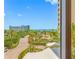 Beautiful ocean view from the building exterior with palm trees and well-maintained landscaping at 1200 Gulf Blvd # 404, Clearwater Beach, FL 33767