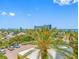 An exterior view features blue skies, palm trees and an ocean view with parking at 1200 Gulf Blvd # 404, Clearwater Beach, FL 33767