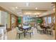 Well-appointed game room featuring multiple tables and chairs for social gatherings and activities at 1200 Gulf Blvd # 404, Clearwater Beach, FL 33767