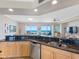 Beautiful kitchen with dark granite countertops and stainless steel appliances at 1200 Gulf Blvd # 404, Clearwater Beach, FL 33767