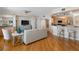Cozy living space featuring hardwood floors, neutral tones, and an open layout to the kitchen at 1200 Gulf Blvd # 404, Clearwater Beach, FL 33767