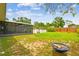 Lush backyard with an above ground pool and enclosed porch at 12106 Meadow Ln, San Antonio, FL 33576