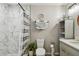 Bathroom featuring marble tiled shower, gray vanity with storage, and neutral decor at 12106 Meadow Ln, San Antonio, FL 33576