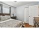 Bedroom with wood floors, gray walls, and a full size bed at 12106 Meadow Ln, San Antonio, FL 33576