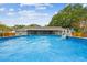 View of above ground pool and home's backyard at 12106 Meadow Ln, San Antonio, FL 33576