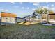 Well-maintained backyard featuring a shed and screened-in pool area, perfect for outdoor entertaining at 12343 Ascot Ln, Spring Hill, FL 34609