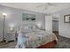 Cozy bedroom features a beach-themed decor and a ceiling fan, creating a relaxing retreat at 12760 Indian Rocks Rd # 578, Largo, FL 33774