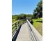 Community boardwalk through grassy area at 12760 Indian Rocks Rd # 578, Largo, FL 33774