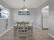 Bright dining area with a white table and chairs, adjacent to the kitchen at 12760 Indian Rocks Rd # 578, Largo, FL 33774