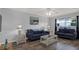 Inviting living room with stylish decor, a ceiling fan, and natural light at 12760 Indian Rocks Rd # 578, Largo, FL 33774